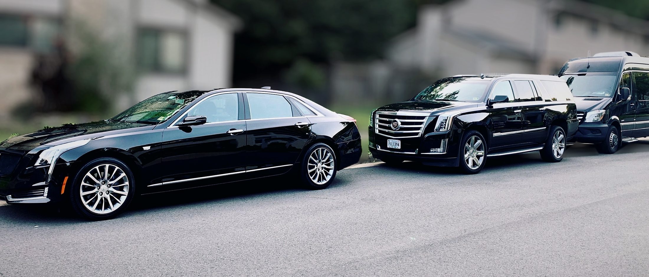 Falcon Valet Cadillac CT6 sedan, Escalade SUV and Mercedes Sprinter parked in a row